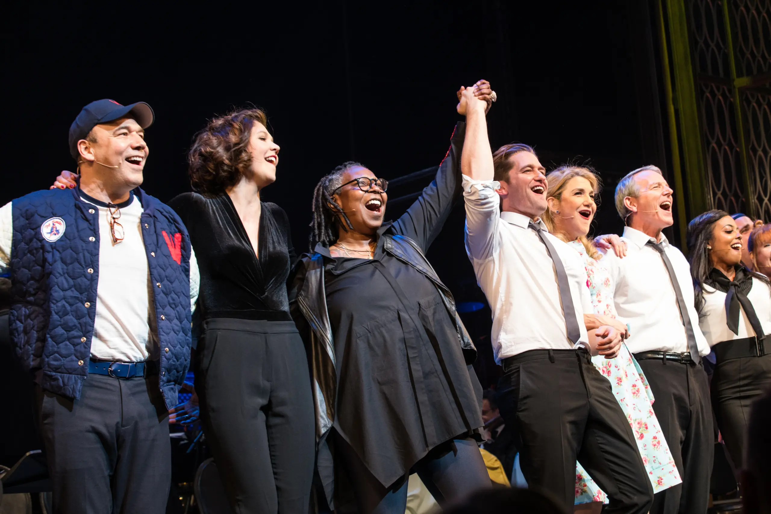 Whoopi Goldberg and other cast members of Damn Yankees standing for curtain call