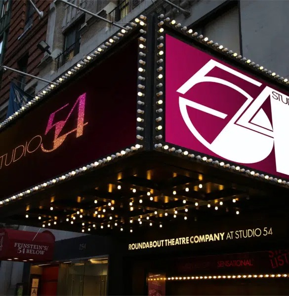 Exterior of photo of Studio 54 showing the classic 1970s logo